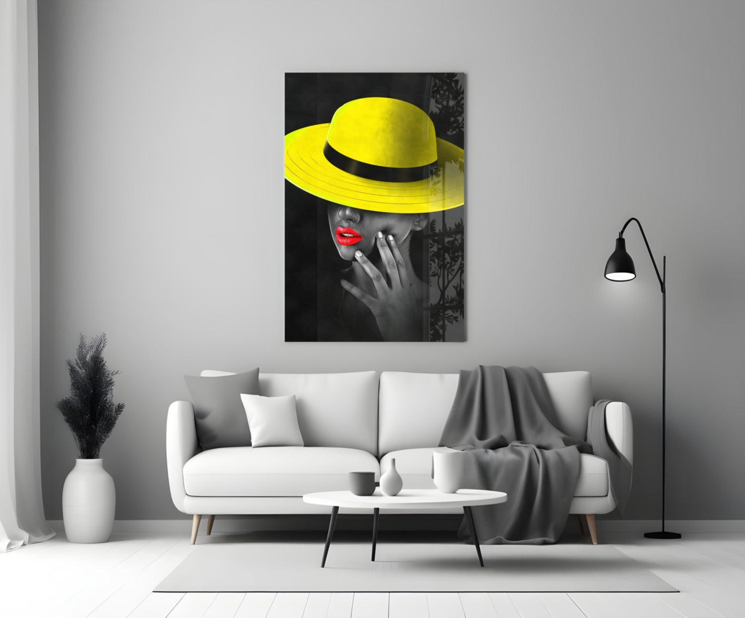 Yellow Hat Glass Wall Art displayed on white wall above white sofa in minimalist living room setting.