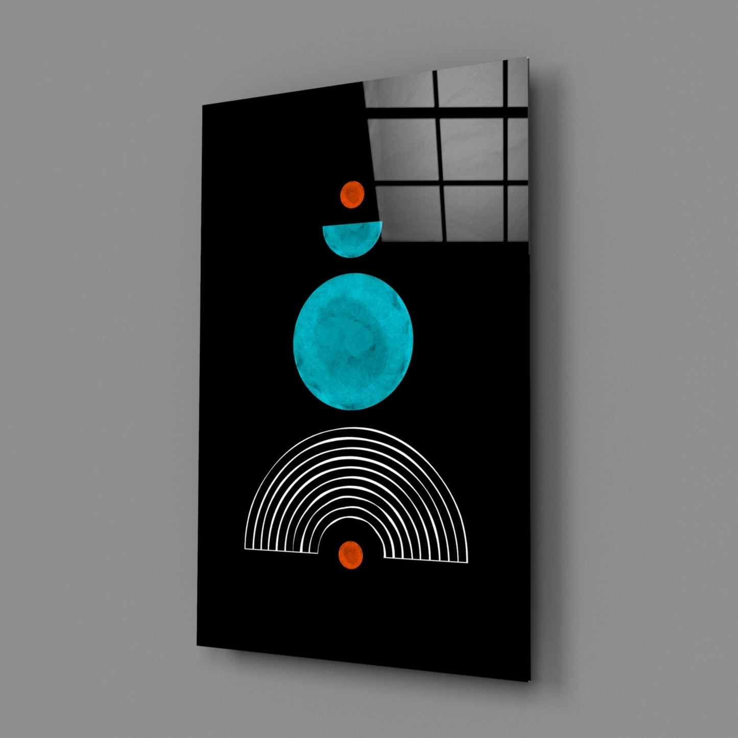 Black glass panel with turquoise circle, cyan semicircle, orange dots, and white concentric arc lines, displayed at an angle against gray background.