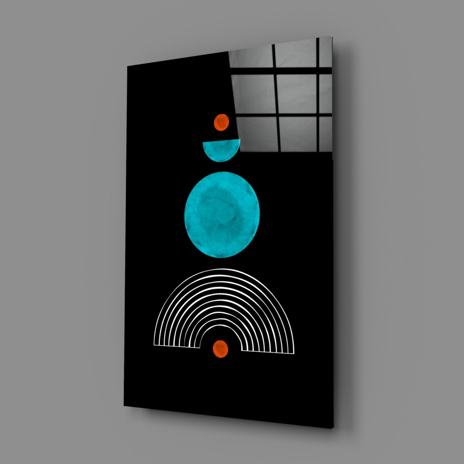 Black glass panel with turquoise circle, cyan semicircle, orange dots, and white concentric arc lines, displayed at an angle against gray background.