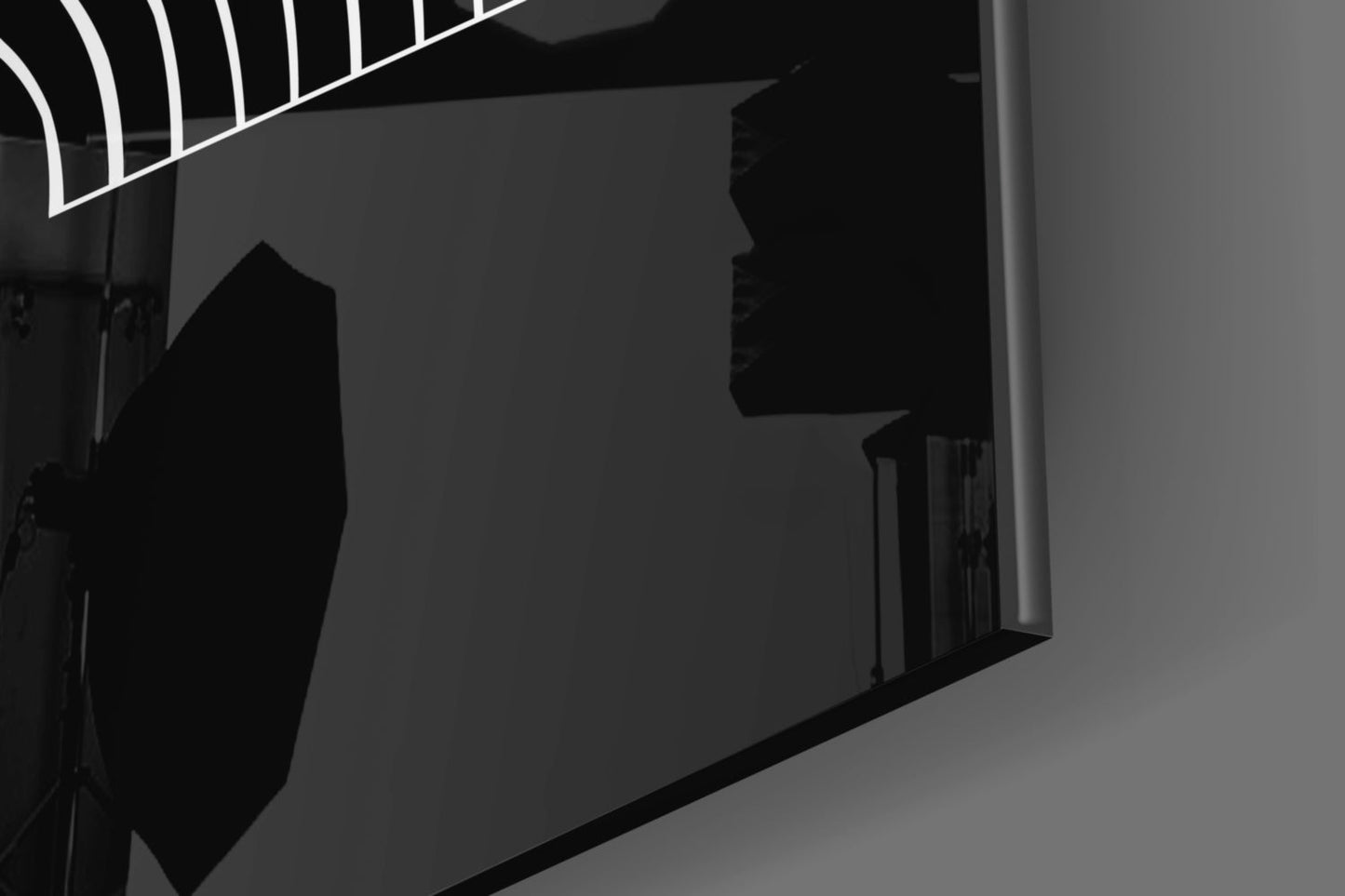 Silhouette of person viewing neon-lined glass wall art installation in darkened gallery space.