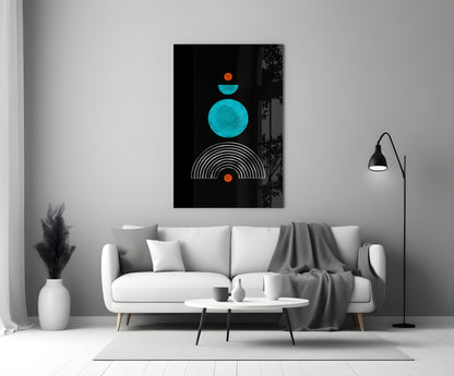 Modern living room with a white sofa displaying turquoise and orange geometric art above it.