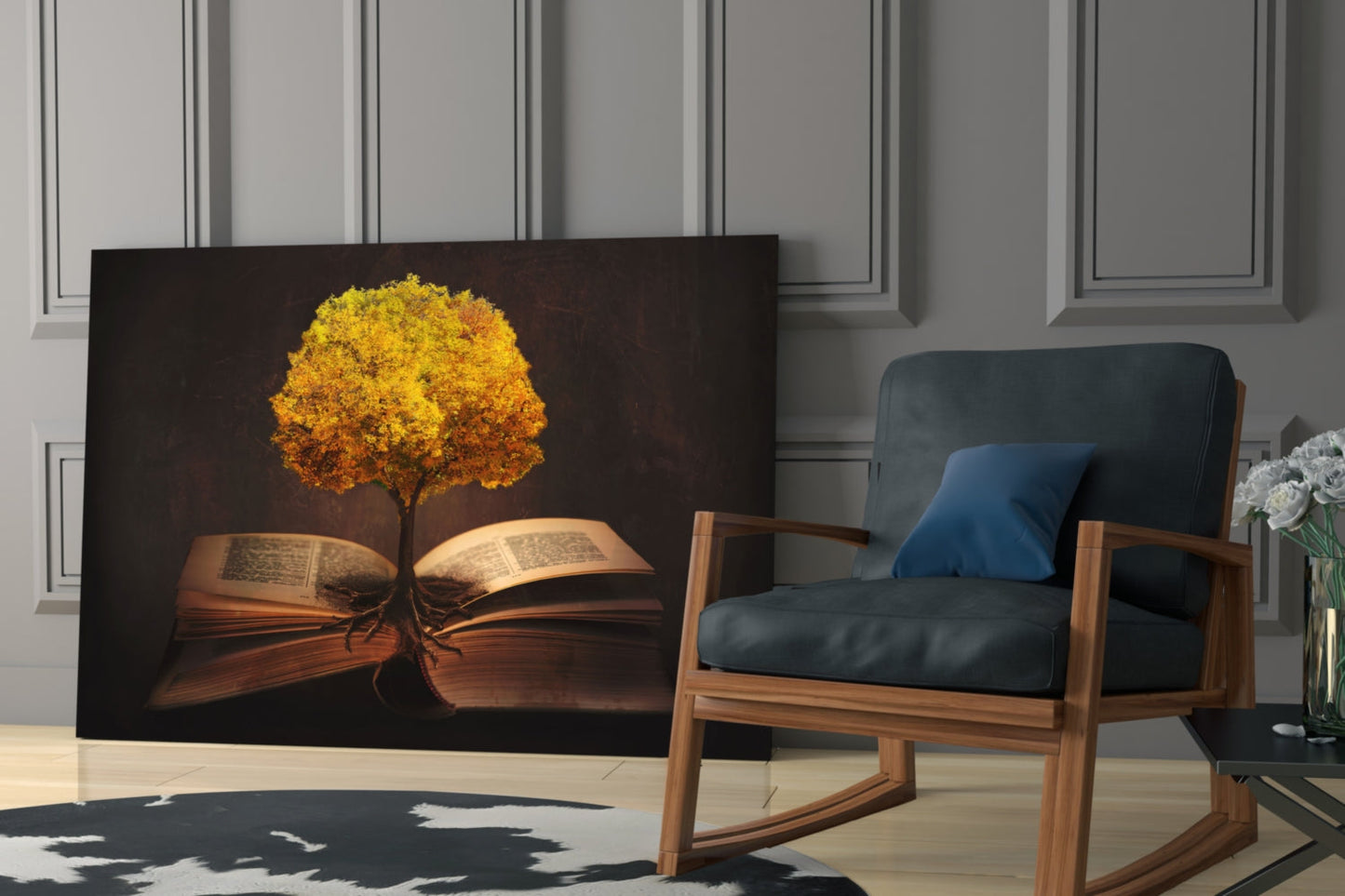 Glass wall art depicting a glowing golden tree growing from open book pages against dark background, displayed in modern living room with wooden chair.