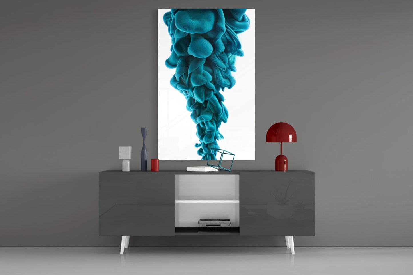Blue Layers Glass Wall Art displayed on gray wall above modern console table with red lamp and decorative objects.