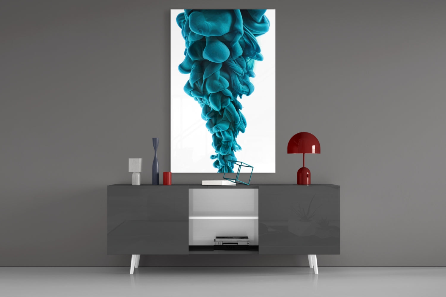 Blue Layers Glass Wall Art displayed on gray wall above modern console table with red lamp and decorative objects.