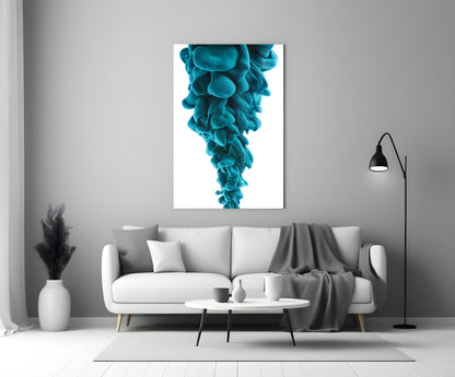 Turquoise layered glass art print displayed above a white sofa in a minimalist living room interior.