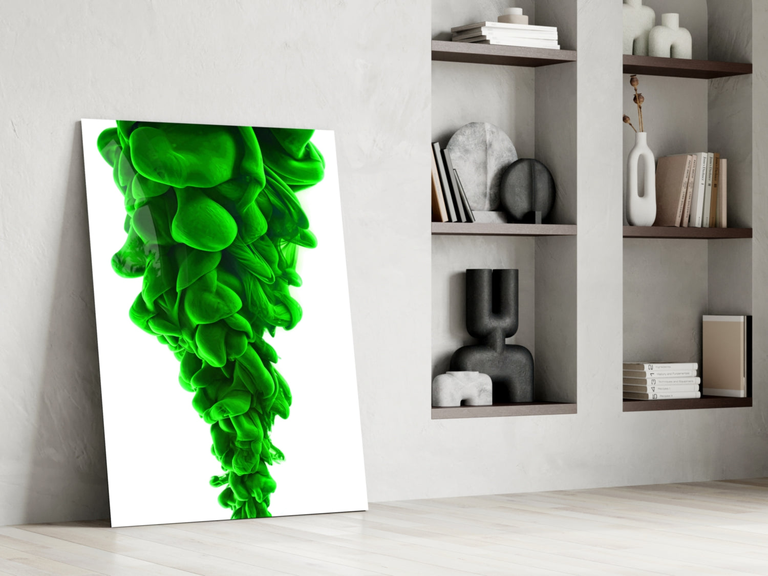Vibrant green layered glass wall art leaning against white wall beside shelving unit displaying decorative objects.