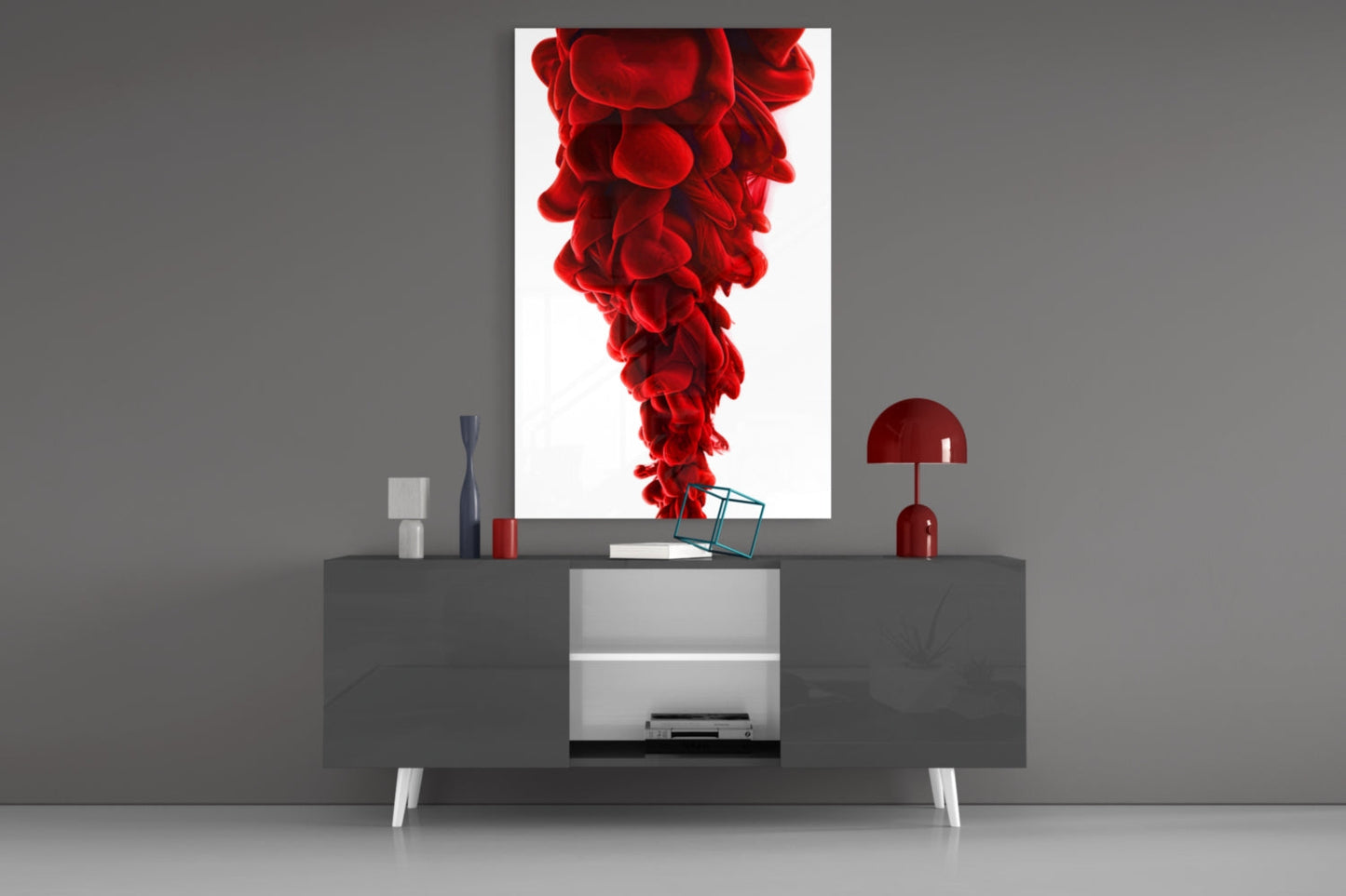 Red Layers Glass Wall Art displayed above gray media console with red lamp and decorative accessories in modern interior setting.