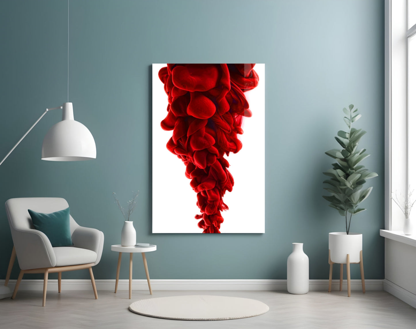 Red Layers Glass Wall Art displayed on a muted teal wall above a white armchair in a modern interior setting.