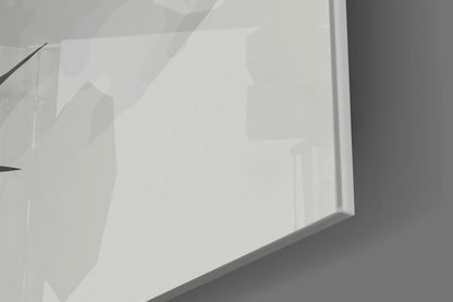 Close-up angled view of translucent white glass panel with subtle yellow tones and shadow details visible through surface.