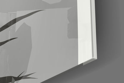 Close-up angled view of frosted glass panel with dark curved leaf designs and white illuminated edge against gray background.