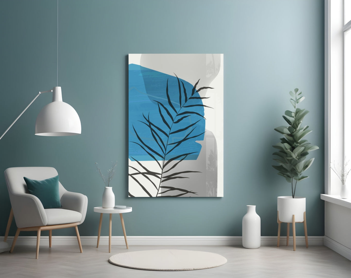 Modern living room interior displaying blue and grey abstract leaf artwork on teal wall above white chair.