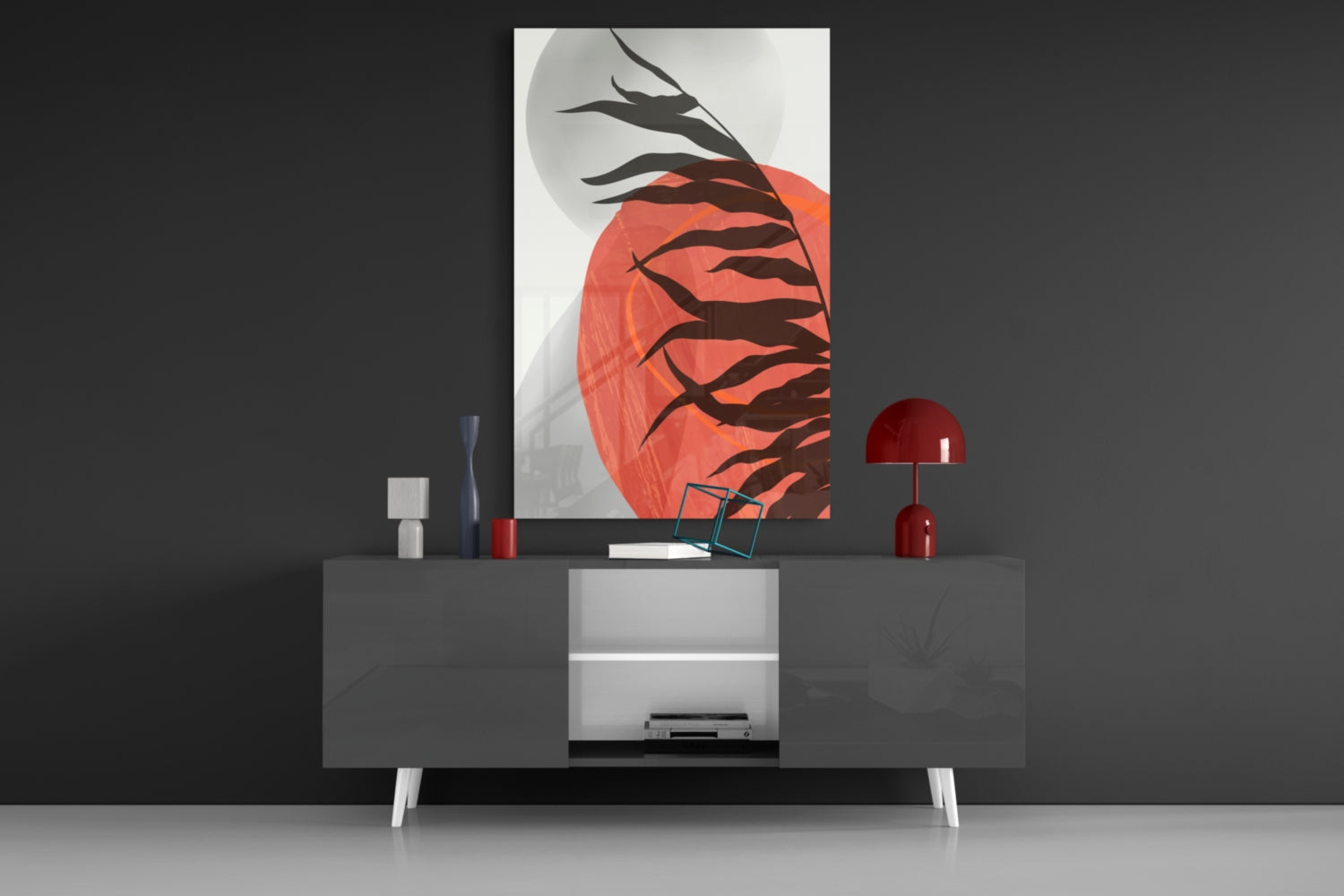 Modern living room display featuring red and black branching design glass wall art hung above gray media console with red accents.
