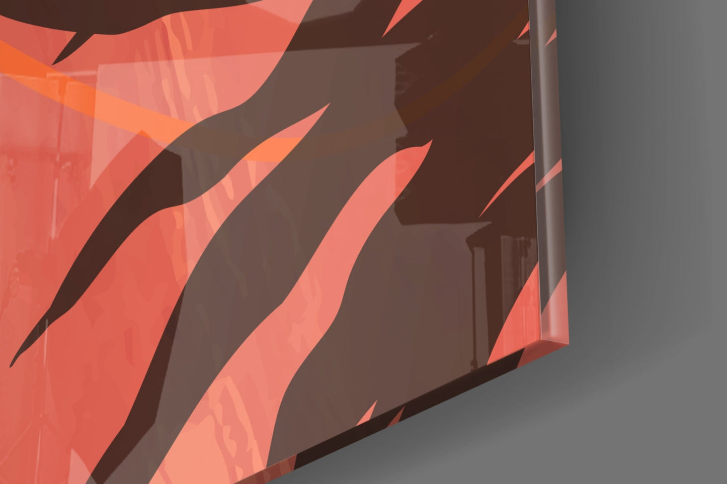 Close-up angled view of red and coral glass wall art with diagonal striped pattern and dark brown shadows, mounted on gray wall.