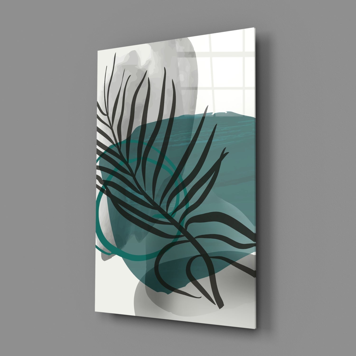 Angled perspective of glass wall art featuring black botanical lines and teal watercolor shapes on cream background.