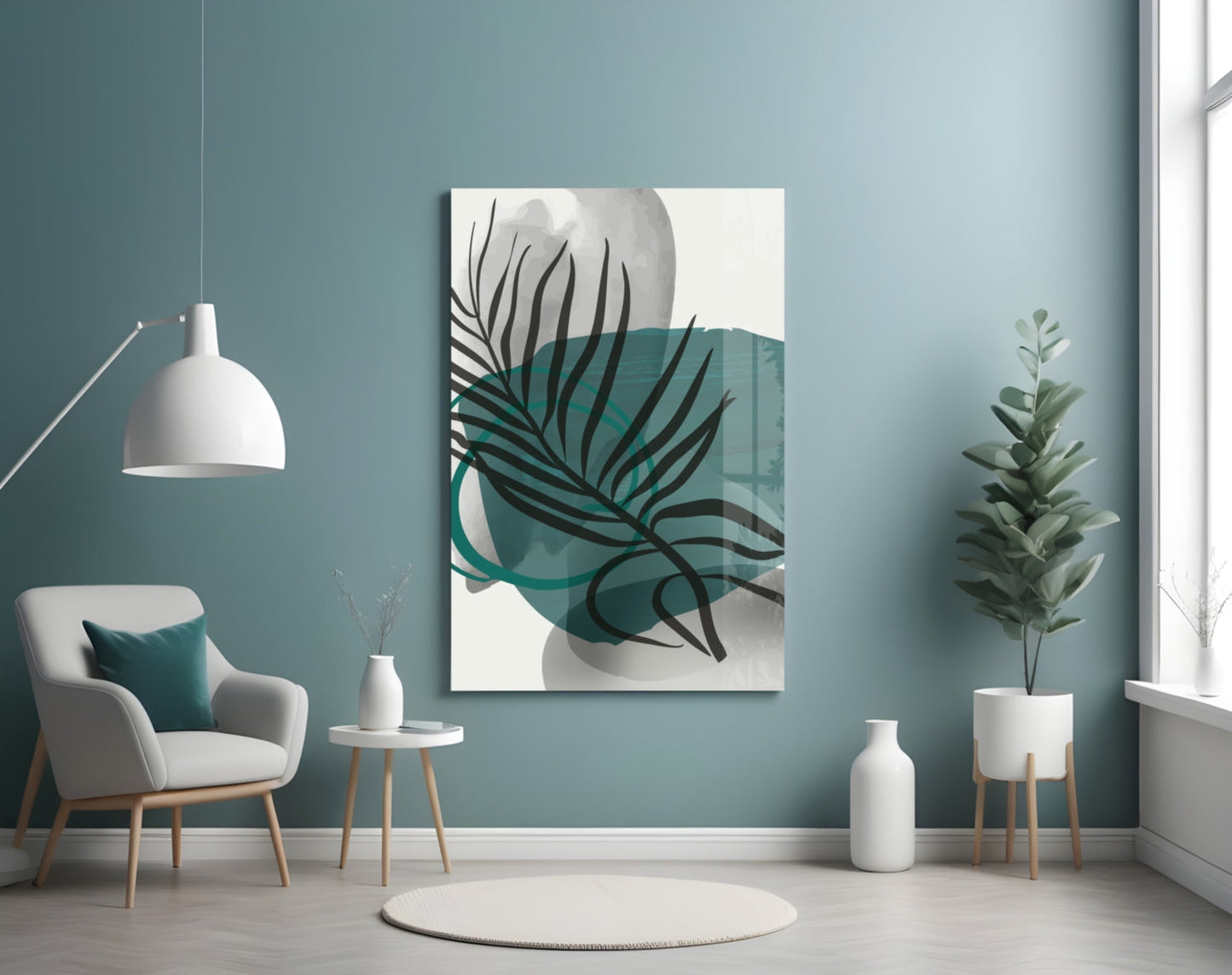 Modern living room with teal wall displaying abstract botanical glass art featuring black leaf lines and teal watercolor shapes.