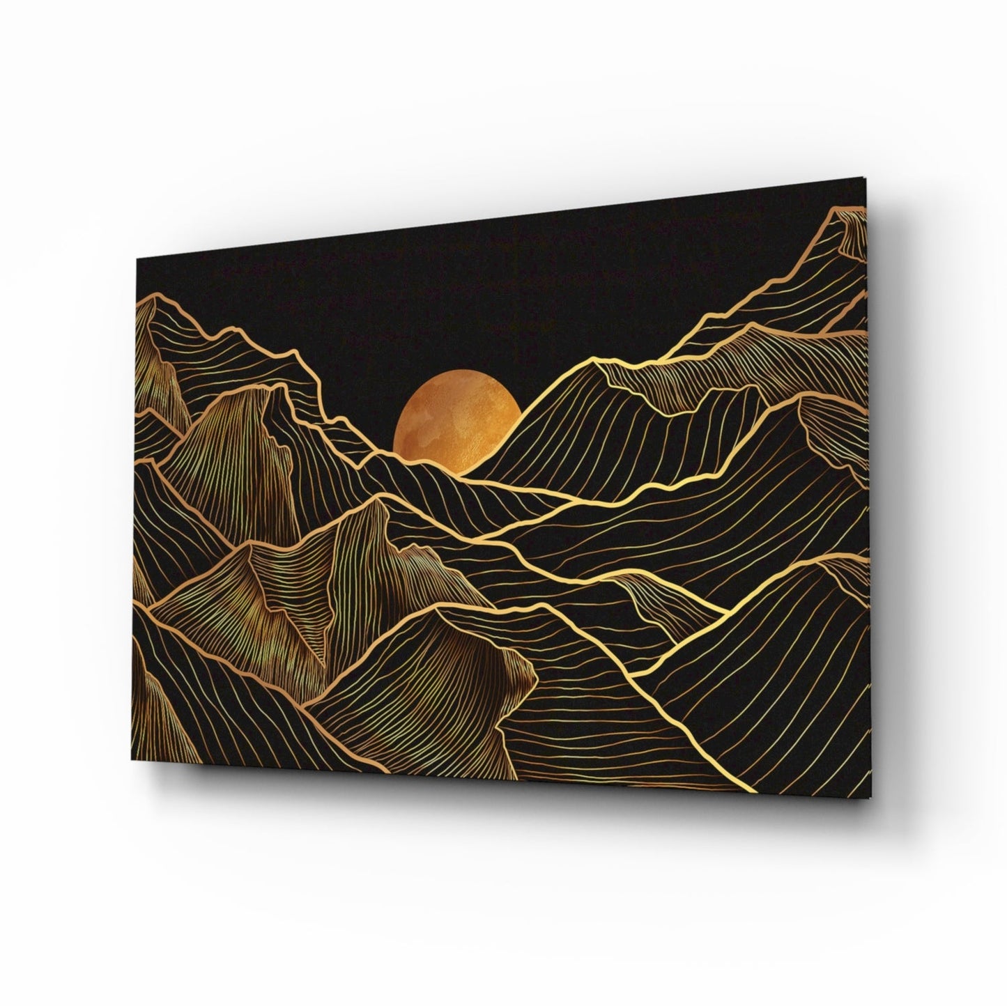 Black glass panel with gold line-art mountains and a golden sun, displayed at an angle showing depth and shadow.