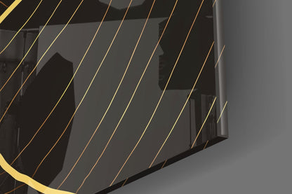 Close-up detail of layered glass panels with gold and bronze striping creating dimensional shadow effects against dark background.