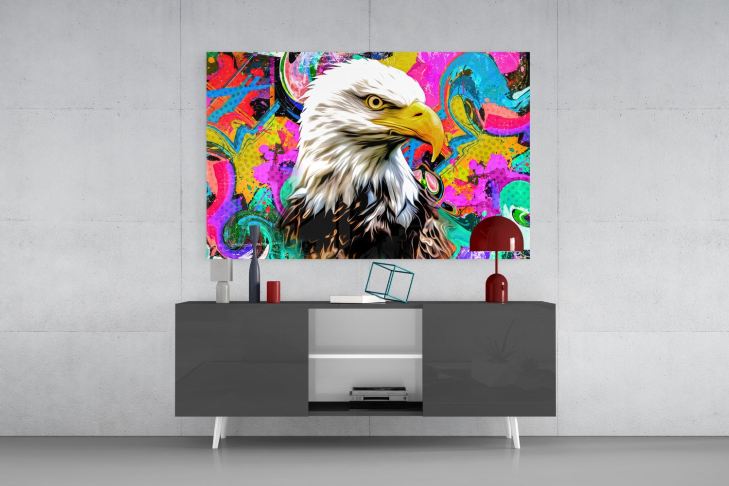 Colorful pop art eagle glass wall art mounted above a dark and white TV console in a modern living room setting.