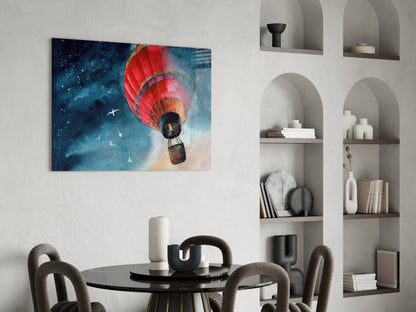 Red hot air balloon with starry night sky displayed as glass wall art above a round dining table with chairs.