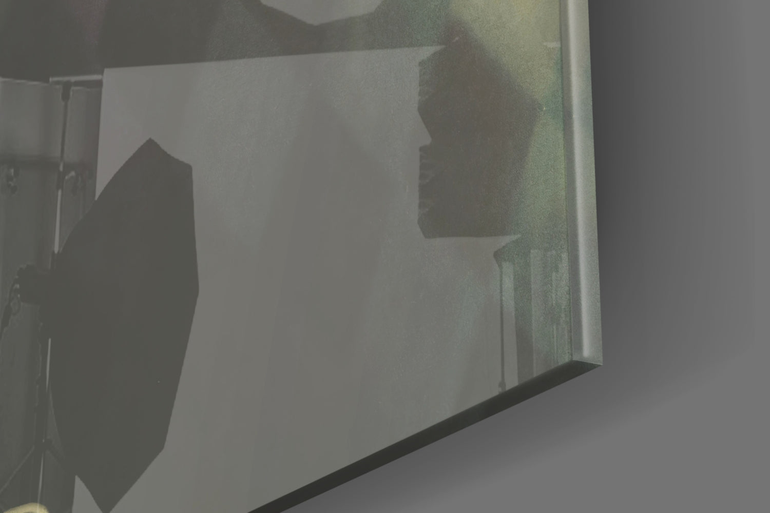 Silhouettes of two figures visible through frosted glass wall panel with dark frame, side view angle.