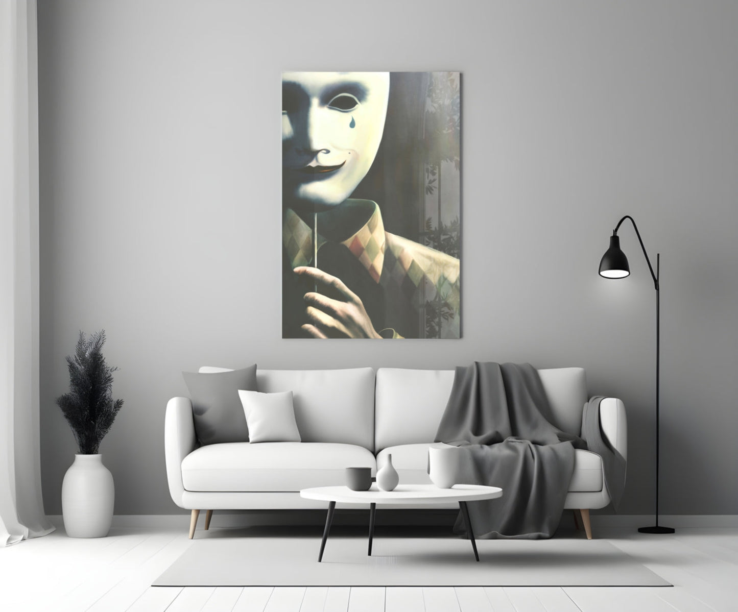Glass wall art depicting a figure in white mask with tear, wearing brown jacket, displayed above white sofa in modern living room.