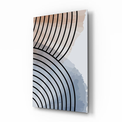 Glass wall art featuring black curved concentric lines transitioning from warm beige tones to cool blue-gray shades, displayed at an angled perspective.