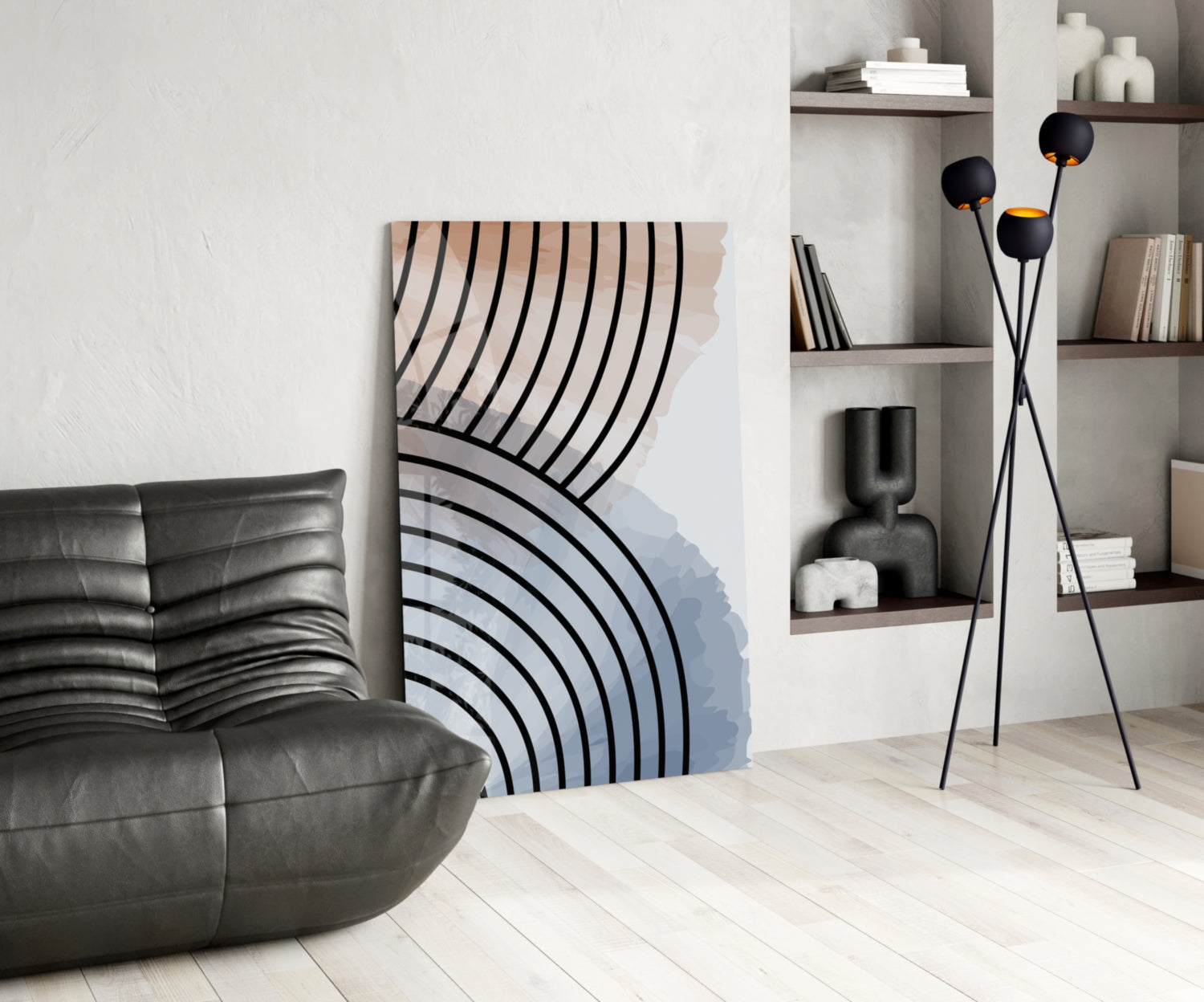 Modern living room interior featuring Lines of Waves glass wall art with black curved lines and blue gradient, displayed between leather sofa and floor lamp.
