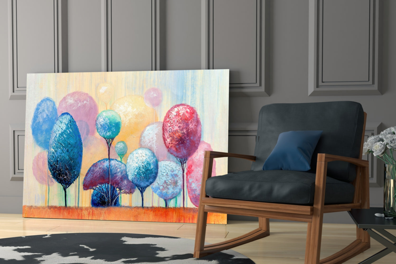 Colorful glass wall art featuring stylized trees with blue, pink, and red foliage displayed in modern interior setting beside wooden chair.