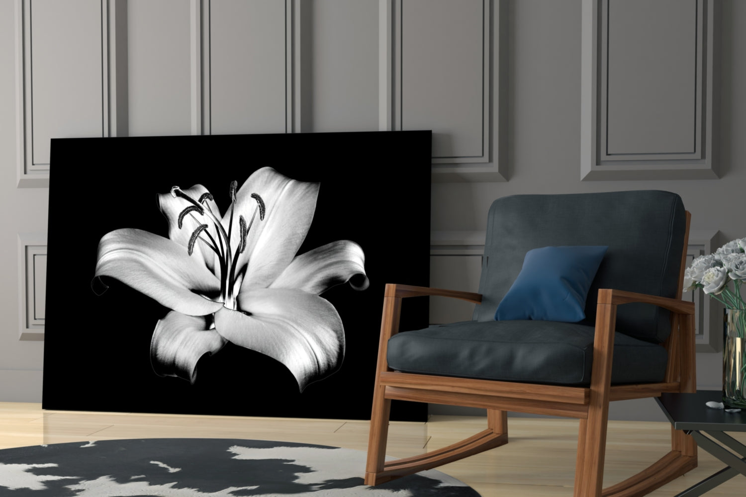 Black glass wall art displaying a white lily flower with stamens against dark background, displayed in modern living room setting.