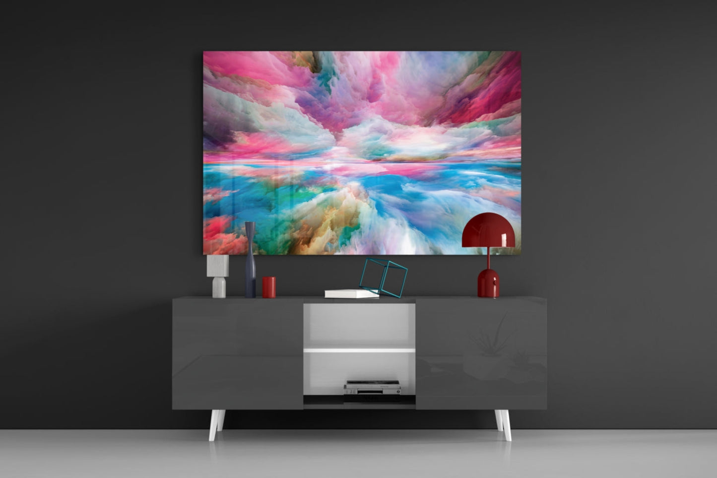 Colorful abstract glass wall art displaying pink, blue, and white cloud-like patterns mounted above a modern media console.