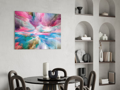 Colorful abstract glass wall art with pink, blue, and rainbow hues displayed above a black dining table in a modern interior setting.