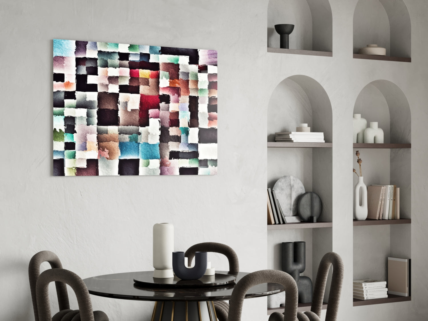 Colorful abstract glass wall art with multicolored watercolor blocks displayed above a black dining table in a modern interior.