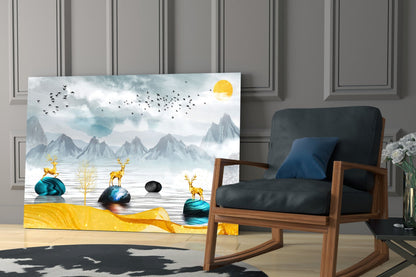 Modern living room displaying glass wall art featuring golden deer, teal rocks, and misty mountains under yellow sun, positioned beside wooden-framed chair.