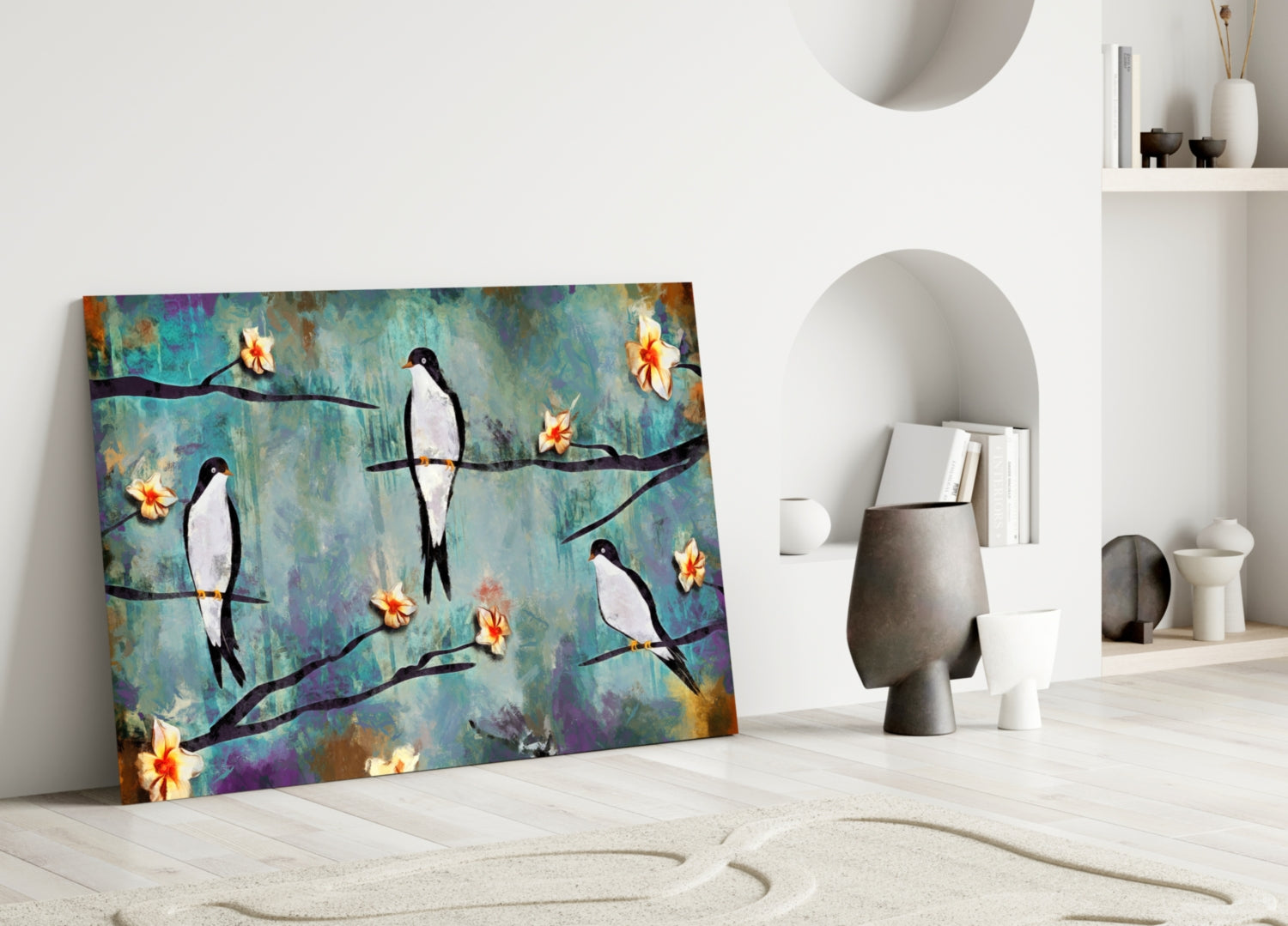 Colorful glass wall art leaning against white wall displays stylized black birds perched on branches with yellow flowers against textured teal and purple background.