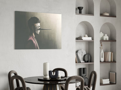 Profile portrait of man with extended nose on glass panel displayed above black dining table in modern interior.
