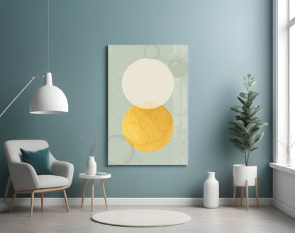Sun and Moon Glass Wall Art displayed on a teal wall above a white armchair in a minimalist interior setting.