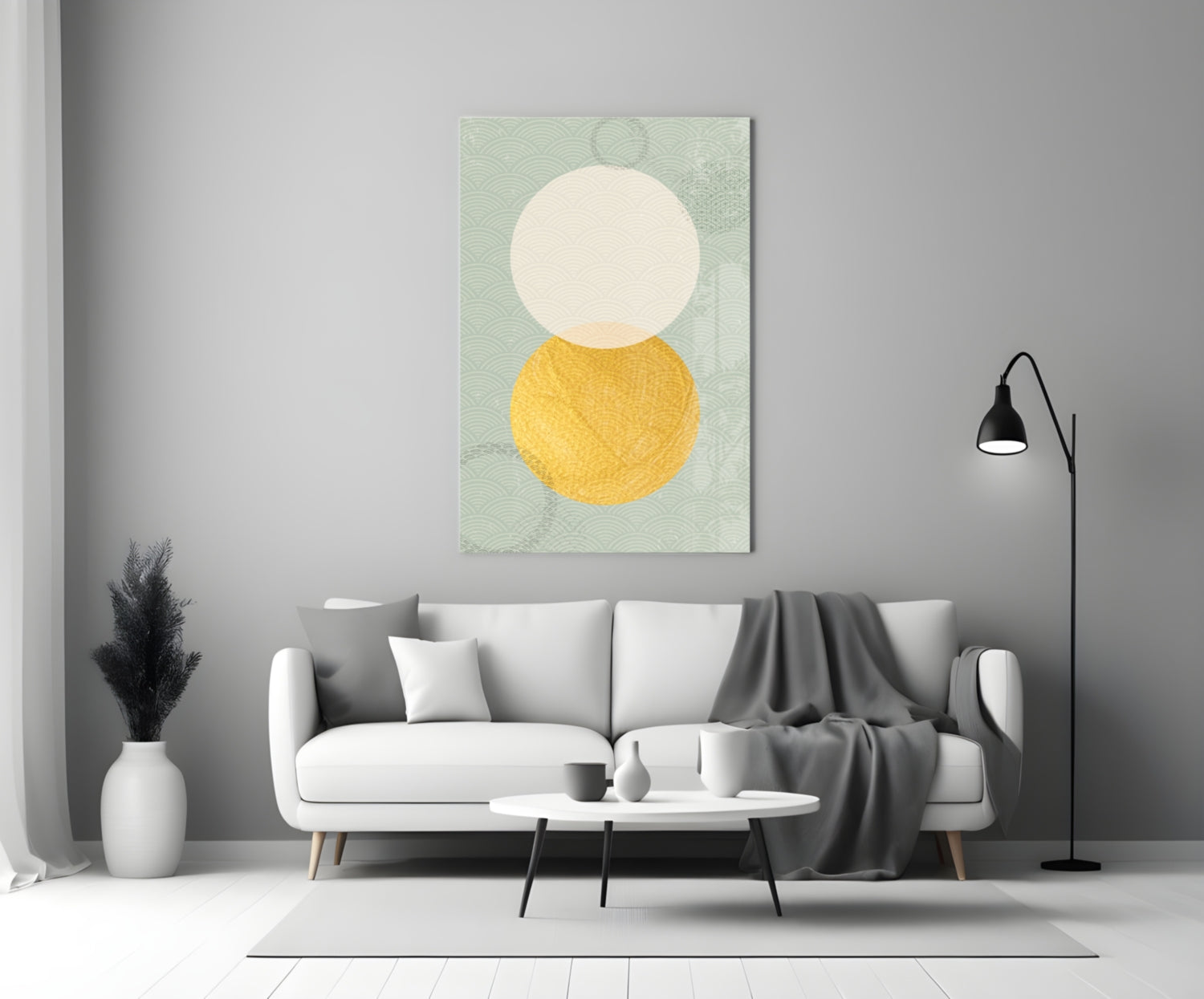 Sun and Moon Glass Wall Art displayed above a white sofa in a minimalist living room setting with sage green patterned background, cream circle, and golden yellow circle.