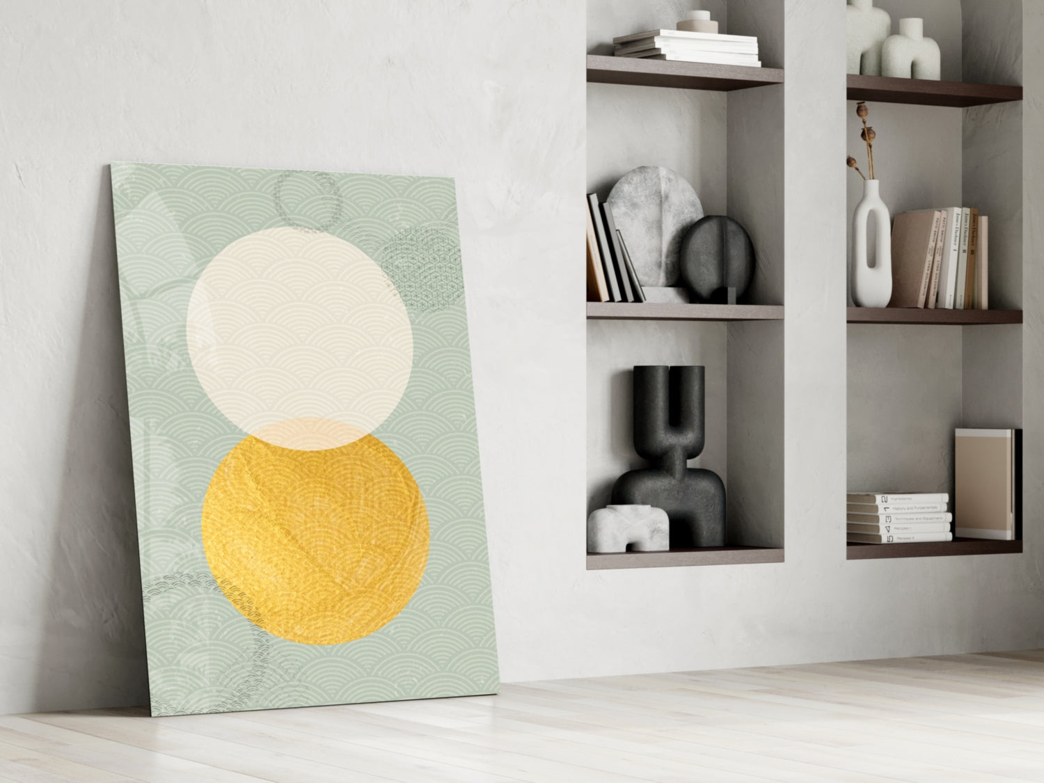 Modern living room interior with geometric glass wall art leaning against white wall beside wooden shelving units displaying decorative objects and books.