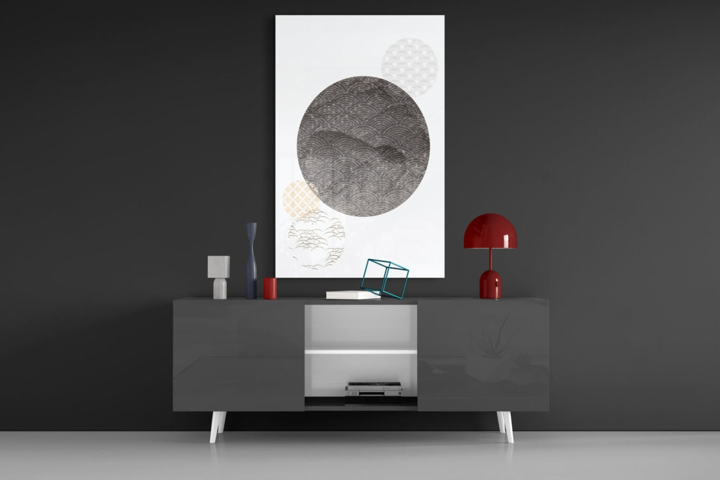 Black Moon Glass Wall Art displayed above a dark console table with red lamps and decorative objects in a modern interior setting.