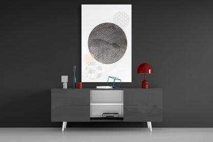 Black Moon Glass Wall Art displayed above a dark console table with red lamps and decorative objects in a modern interior setting.