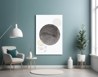 Black Moon Glass Wall Art displayed on teal bedroom wall above white chair, featuring dark patterned circle with lighter geometric circles below.
