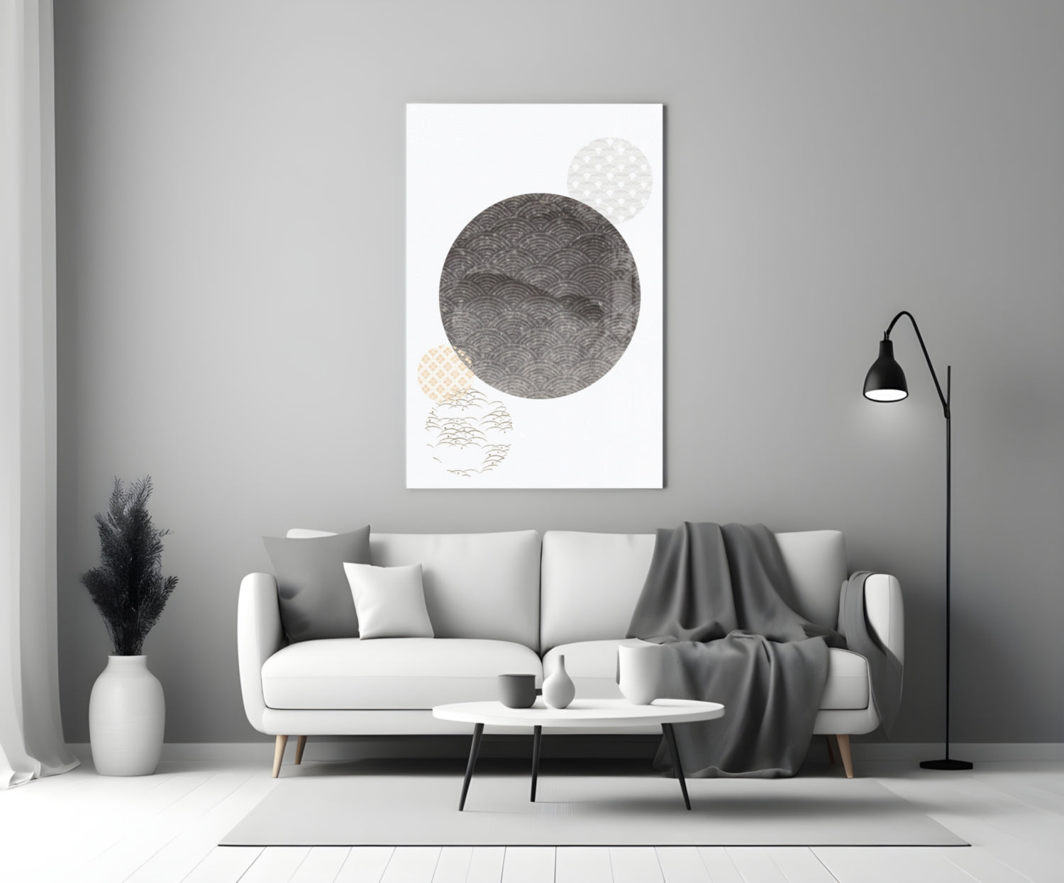 Black Moon Glass Wall Art displayed above a white sofa in a minimalist living room interior with gray accents.
