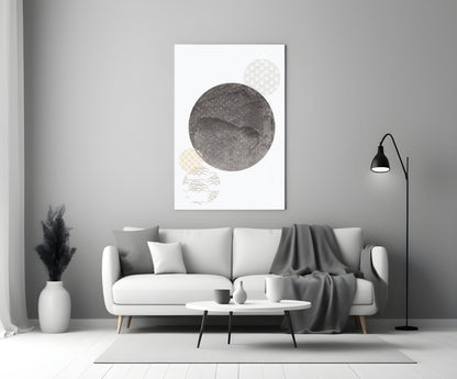 Black Moon Glass Wall Art displayed above a white sofa in a minimalist living room interior with gray accents.