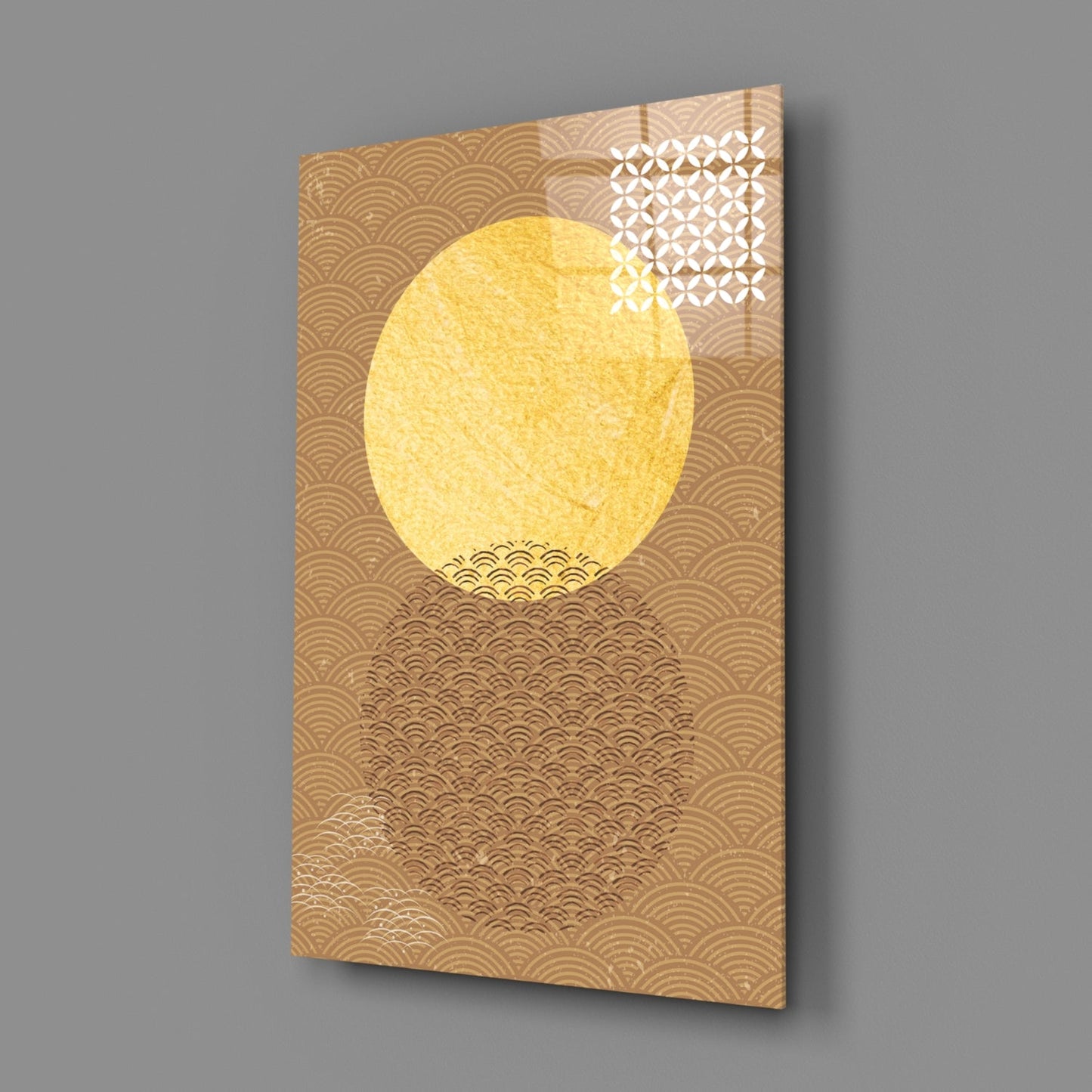 Angled view of glass wall art featuring a large yellow circle against a tan background with geometric wave patterns and white lattice details in the upper right corner.