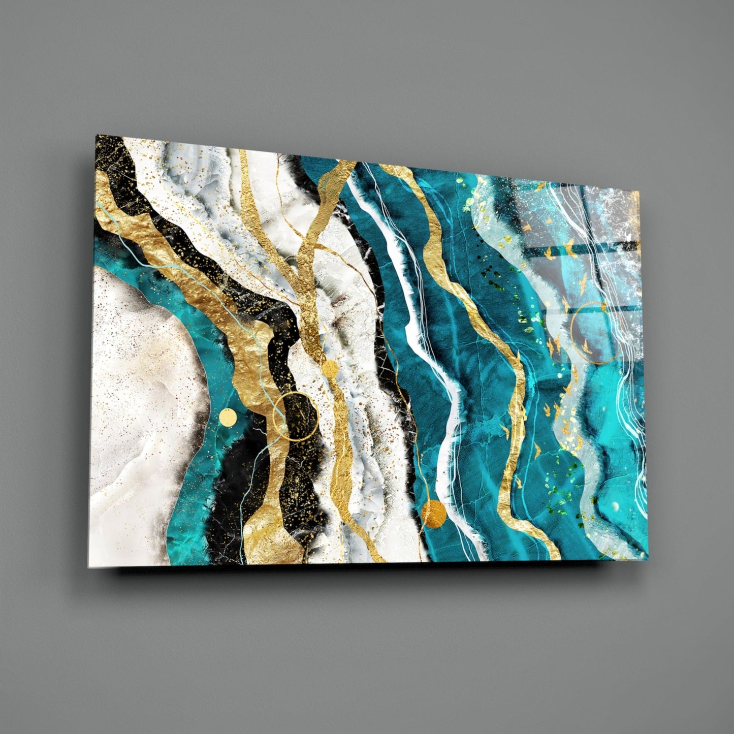 Marble Waves glass wall art displayed at an angle against gray background, showing turquoise, white, black, and gold layered wave patterns.