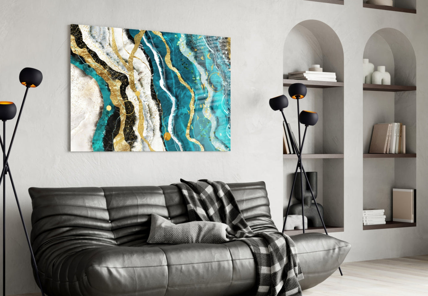 Marble Waves glass wall art displaying turquoise, gold, black, and white striped pattern hung above black leather sofa in modern living room.