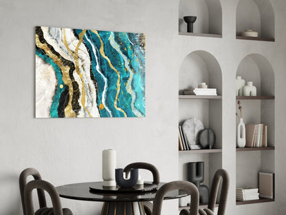 Marble Waves glass wall art displayed above a black dining table in a modern room with built-in shelving, featuring turquoise, gold, black, and white streaked patterns.