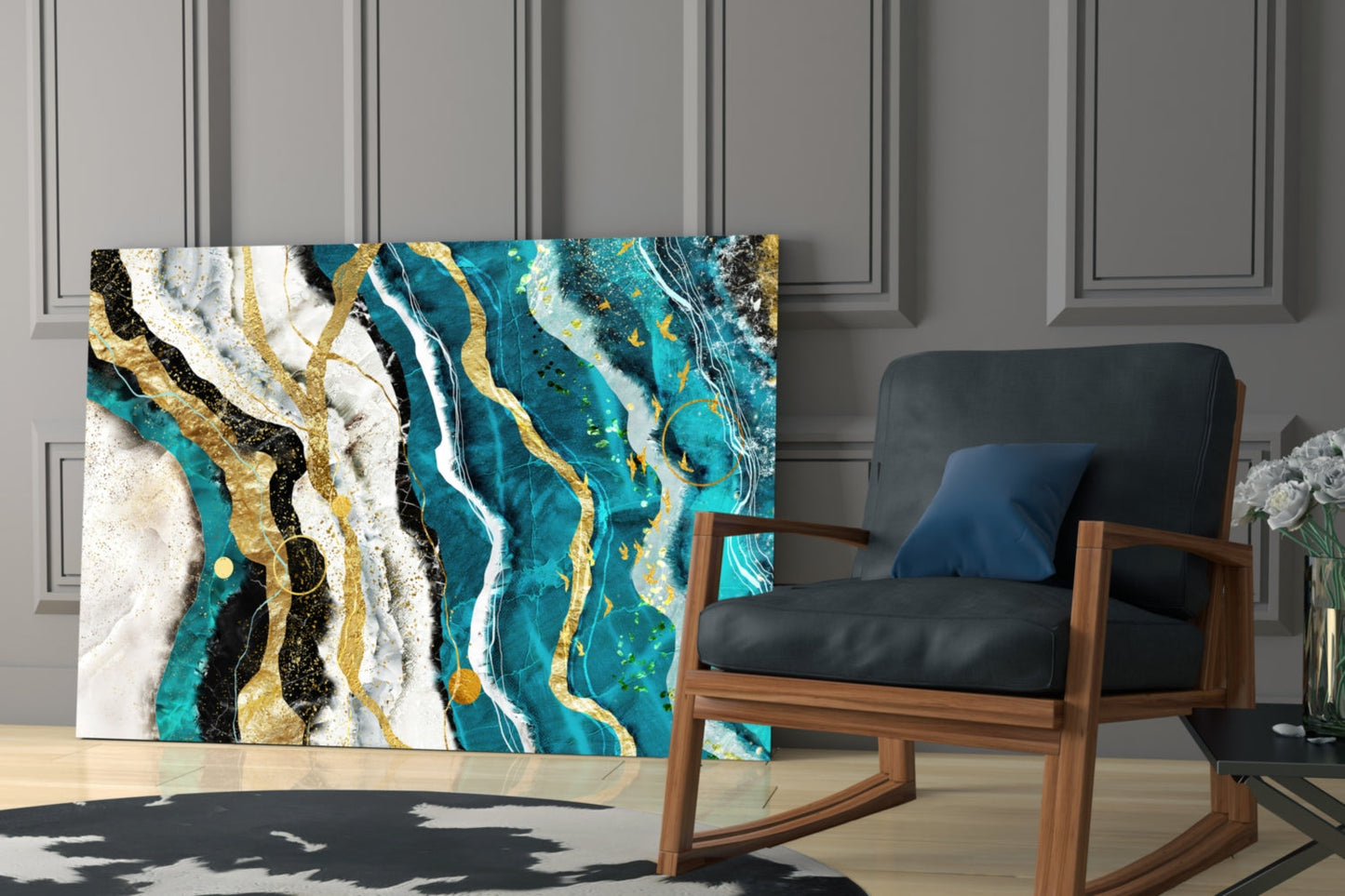 Marble Waves Glass Wall Art displayed leaning against wall beside mid-century wooden chair, featuring turquoise, white, gold, and black swirled patterns.