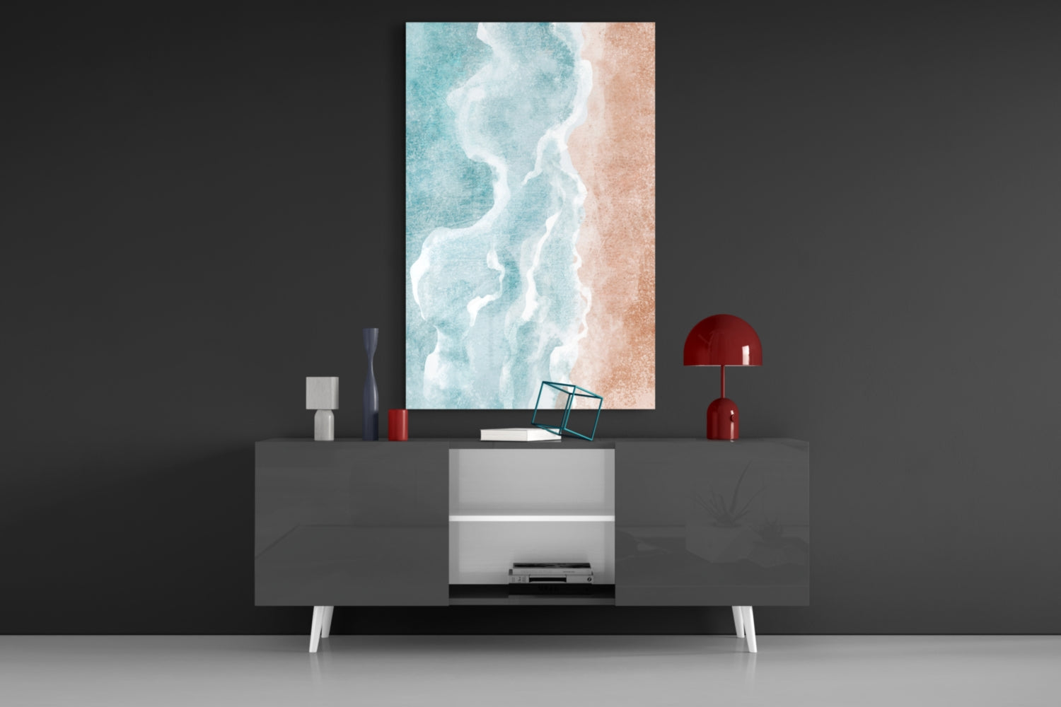 Beach Glass Wall Art depicting turquoise waves and sandy shore displayed above modern gray sideboard with red accents.