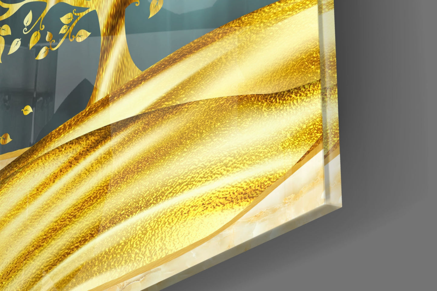 Close-up of layered golden glass with textured surface and tree silhouette design against blue background.